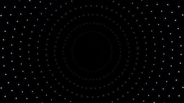 Black background with white dots arranged in circular patterns and scattered dots