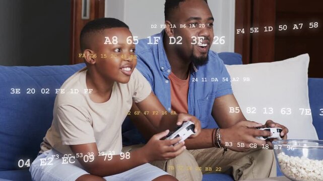 Vertical video: Dad, son pressing pads starting game, lifting pillows, bonding, overlay scrolling