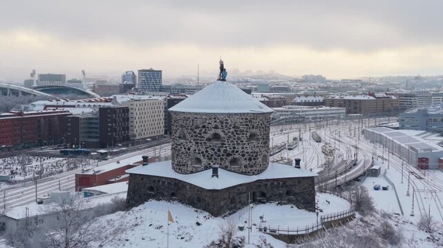 Aerial view of the snow-dusted Skansen Kronan fortress, a stone sentinel overlooking a city blanketed in white, Goteborg, Vastra Gotalands lan, Sweden.