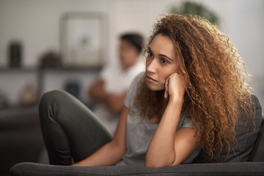 Thinking, woman or couple on sofa with tension, fight or doubt in toxic relationship. Argument anger, reflection or people in home with disagreement, confrontation or disappointment in marriage issue