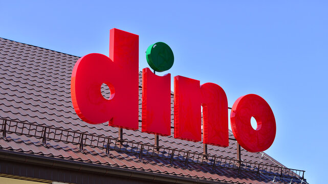 Wesola, Poland. 13 April 2026. Sign board Dino with brand logotype above entrance.