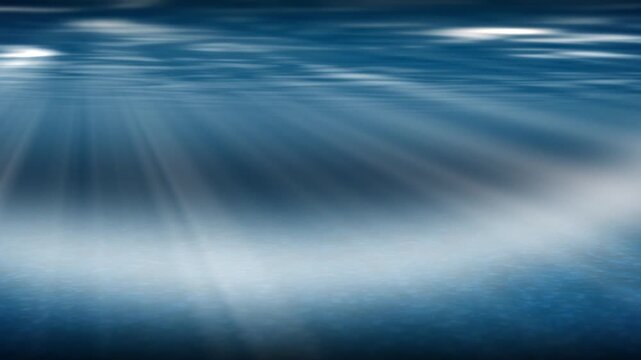 Seamless loop of deep blue underwater background with sun rays (god rays) penetrating the water surface. Authentic caustics light patterns on the ocean floor. 3D render animation.