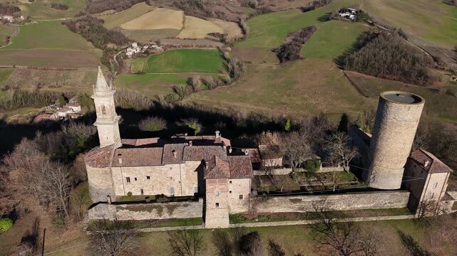 Castello di Monteventano in Monteventano, Piozzano, Piacenza, Emilia-Romagna, Italy, located in Val Luretta with fortified walls, cylindrical tower and surrounding farmland in Apennine foothills