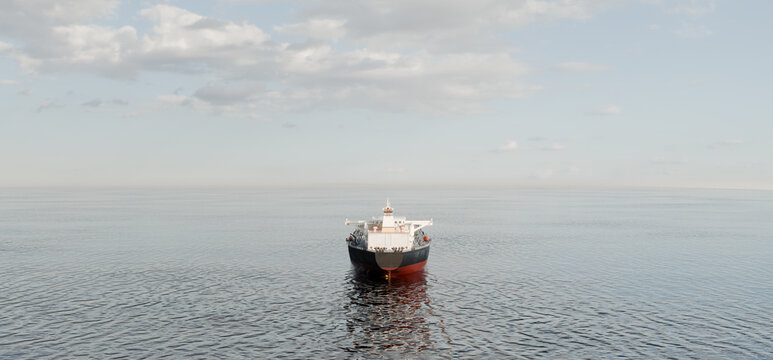 Oil tanker back view in vast calm sea, minimal composition and global energy industry concept