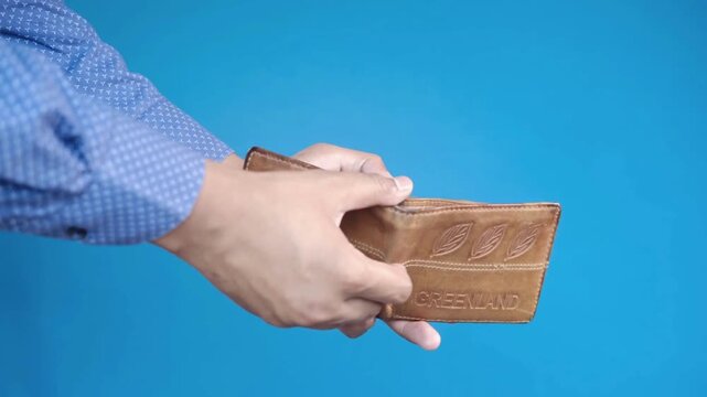 concept of bankruptcy and loss of money. pensioner holding old empty wallet with no cash financial on isolated background