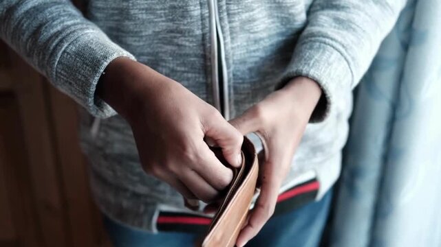 man looks into and showing empty wallet. Inflation money unemployment Bankruptcy finance background