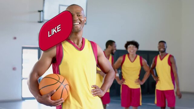 Male player holding basketball posing on gym court, on cue social badges sliding in, covering torso
