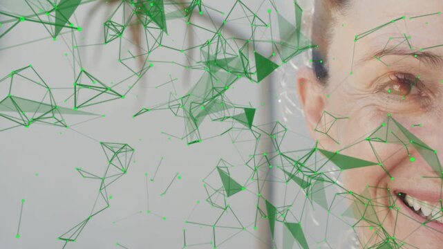 On play, green mesh thinning, revealing mature woman smiling, adding ear sparkles for tech demo