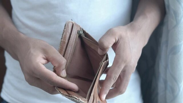 Close up Man hands opening an empty wallet Financial crisis No money poverty concept crisis poor