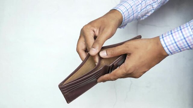 Close up Man hands opening an empty wallet Financial crisis No money poverty concept crisis poor