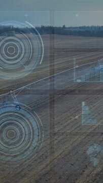 Center-pivot arm advancing over field, auto starting HUD rings tracking wheel motion for irrigation