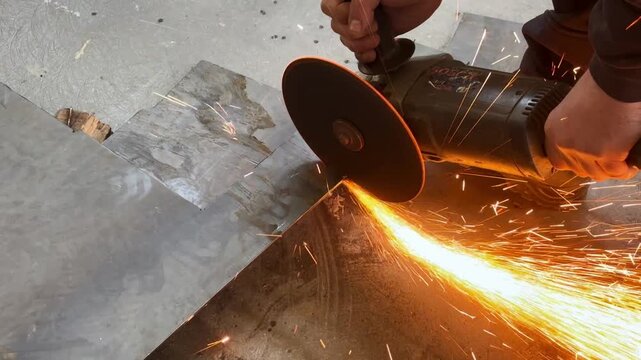 Industry Worker Grinding Metal with Angle Grinder 4K stock video