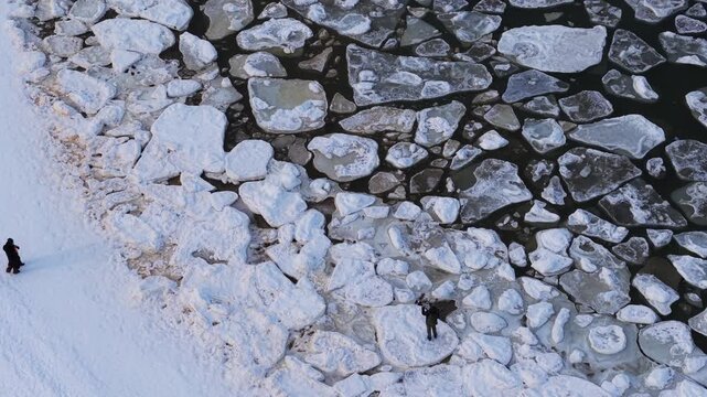 Aerial view of the Baltic sea shows a dramatic contrast between the dark water and bright white ice floes, Sopot, pomorskie, Poland.