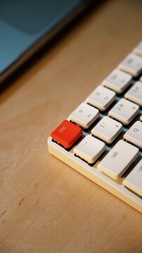 Close up of mechanical keyboard with orange escape key