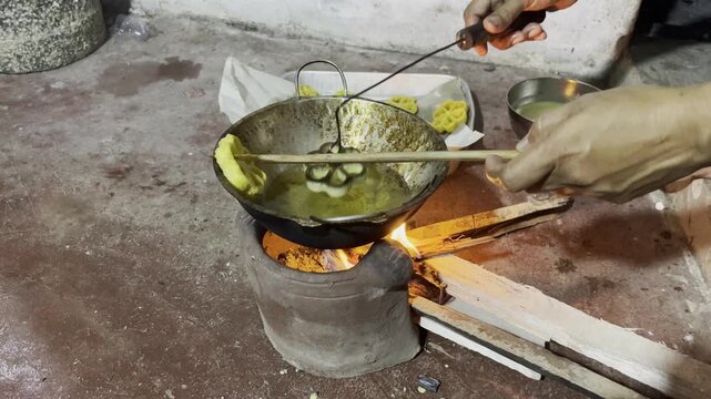 Traditional Sri Lankan Kokis making process - authentic New Year sweet snack preparation in village kitchen