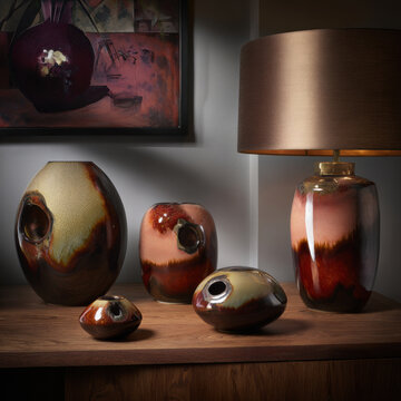 Handcrafted ceramic art pieces and lamp with organic shapes