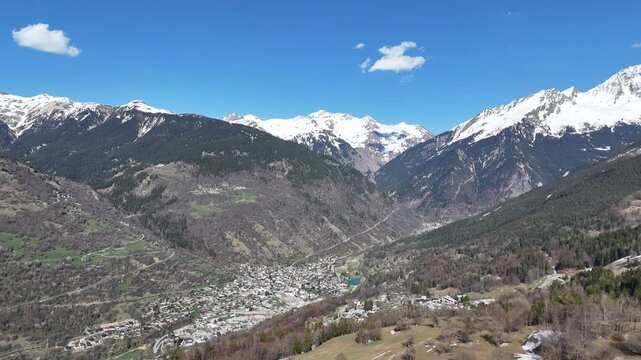 Aerial panaromic view of Courchevel, Bozel between snowy mountains.
