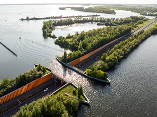 Fototapeta premium Veluwemeer Aqueduct, road crosses under a waterway in the Netherlands. Innovative intersection of highway and Water Bridge.