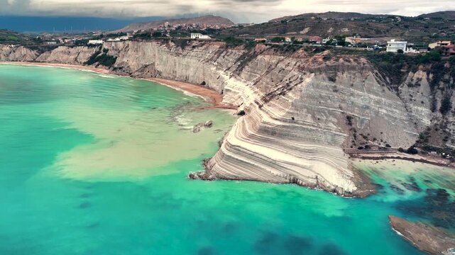 Scala dei Turchi, or the Turkish stairs in Sicily, Italy. Aerial Drone Shot. Unique White Rocks and Turquoise water.