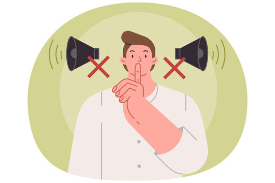 Man makes tss gesture urging him to switch phone to airplane mode and speak in whisper