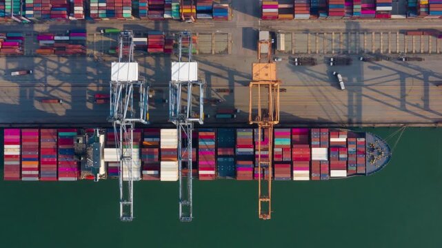 4K time lapse aerial view shot Commercial port harbor export import goods containers loading to ship