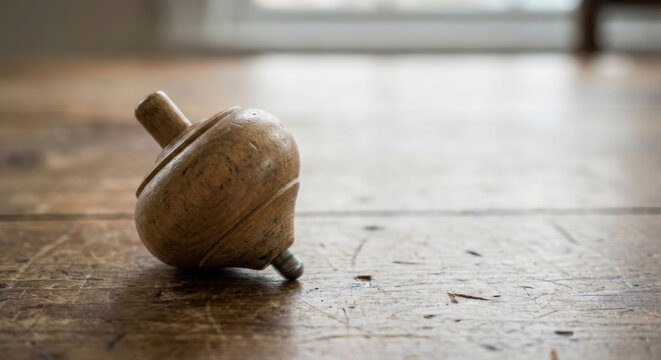 Central bank monetary policy spinning top wooden toy vintage central bank monetary policy concept with wooden spinning top rustic floor suggesting