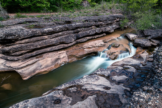 Beautiful creek with rocks and water motion