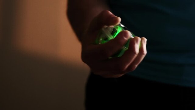 Man Uses A Gyroscopic Wrist Trainer To Enhance Forearm Grip Strength Workout Routine