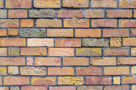 Brick wall showing weathered mortar pattern on exterior