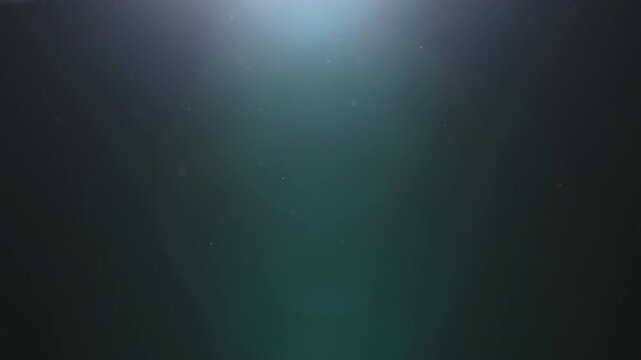 Real dust particles floating in air over dark background