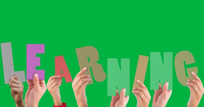 Multiple hands holding learning text banner against black background