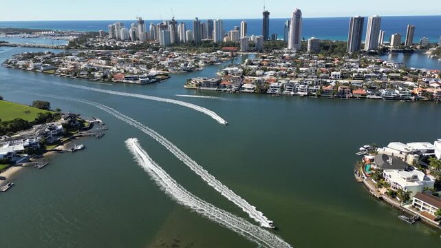 Aerial view Gold Coast Australia. Boats float on the ocean bay, cityscape of skyscrapers, city on the shore.
