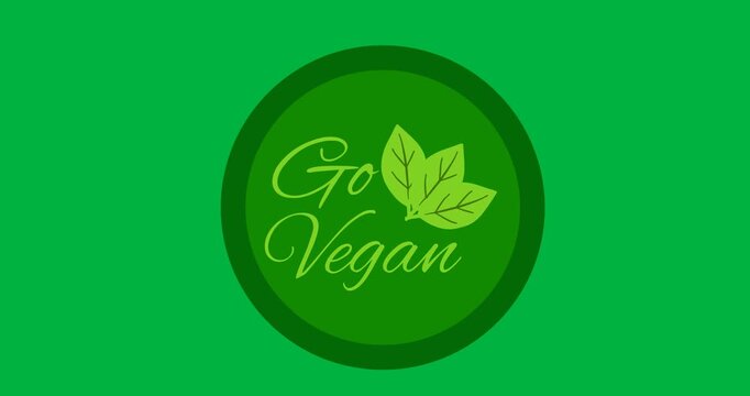 Digital animation of go vegan text with leaves icon over a green round banner on black background