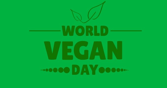 Digital animation of world vegan day text with leaves icon against black background
