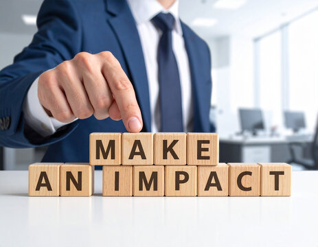 make an impact - Geschäftsmann zeigt auf den Text "make an impact"