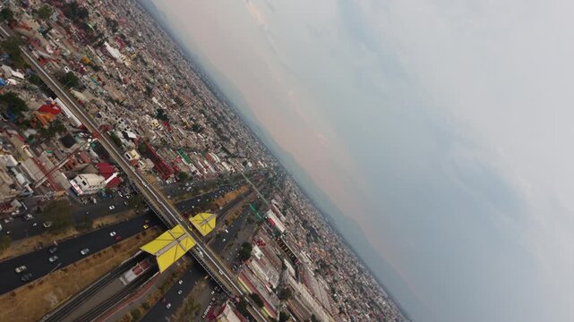 Rotating drone footage of main road in Ecatepec Mexico