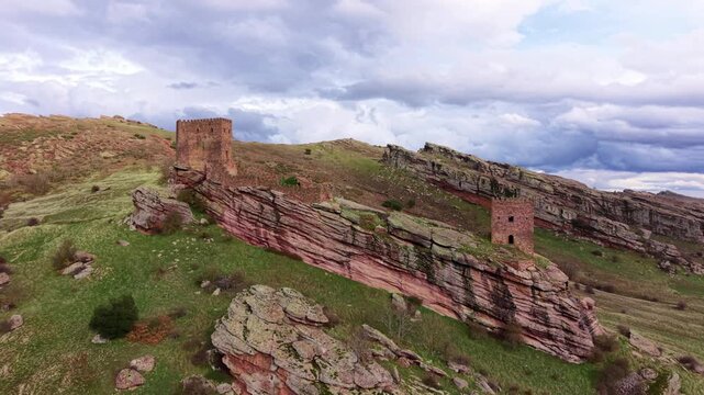 Castle of Zafra, a medieval fortress perched on a dramatic sandstone ridge in Spain, known as the Tower of Joy filming location from Game of Thrones