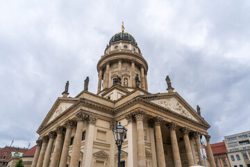Obraz premium Majestic 17th-century French Cathedral with a domed tower, Französischer Dom, located at Gendarmenmarkt square in Berlin.Germany.