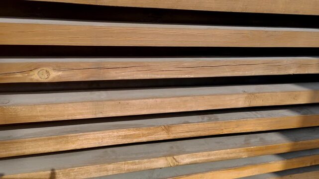 Wooden background consisting of long parallel wooden blocks. Wooden wall texture, architectural style. Clean, rhythmic, and natural aesthetic.	
