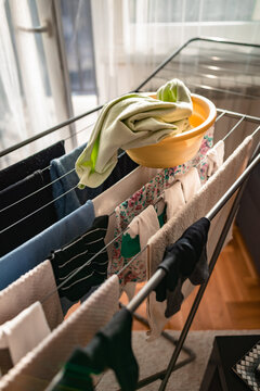 Drying laundry on a rack at home.