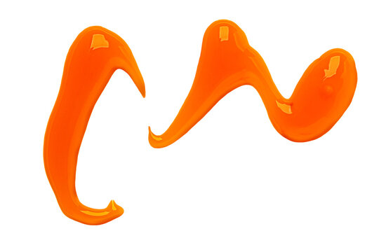 Swirling orange sauce creating abstract art shape