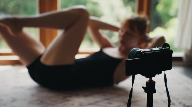 Fitness influencer vlogging home workout routine