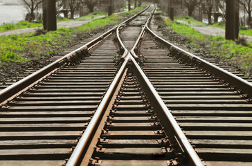 crossing Railway track  perspective View of the cross crossing railway train tracks are on a railroad track © Maxim Chuev