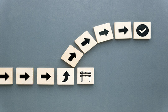 Arrows shift direction to bypass a barrier and reach success, representing strategic change, problem-solving, and adaptive thinking in business or life