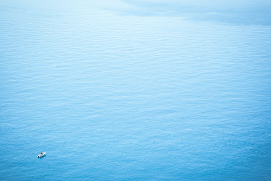 Thyrrenian Sea, Acquafredda, Italy: Small boat on calm blue ocean water