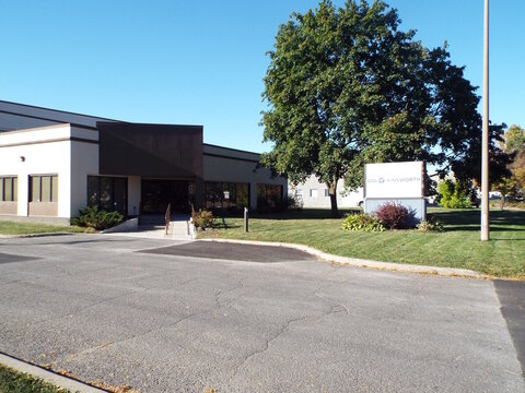 Nepean, Ontario, Canada &ndash; July 27, 2025: The "GDI Ainsworth" office building features a modern low-rise facade, a paved parking area, and a prominent monument sign at 69 Auriga Drive.