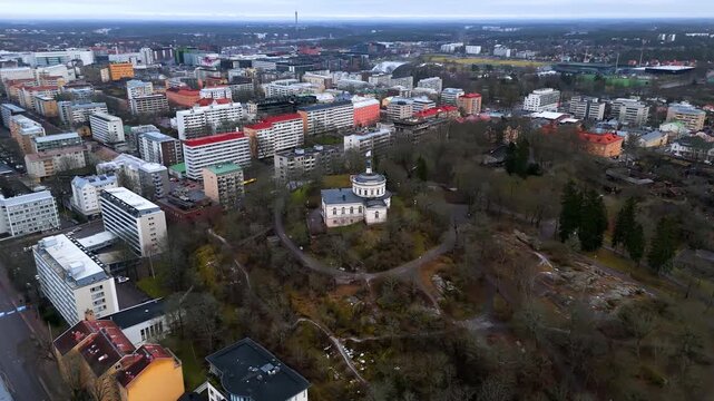 Panoramic drone shot around the Vartiovuori Observatory, cloudy day in Turku