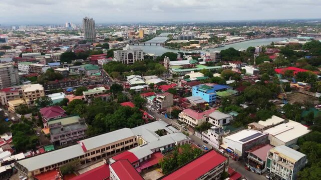 drone reveals cityscape of Iloilo City, Panay Island, Philippines with the rivers and modern skyline
