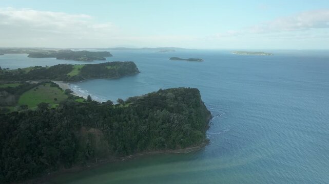 Aerial Behind Cliff with View of Beach and Sea