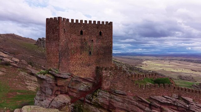 Medieval Castle of Zafra perched on a dramatic sandstone ridge in Spain, historic fortress and Game of Thrones filming location known as the Tower of Joy